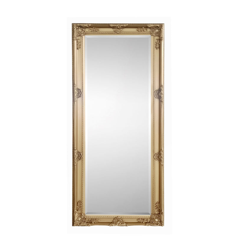 Decorative gold-framed mirror on a white background