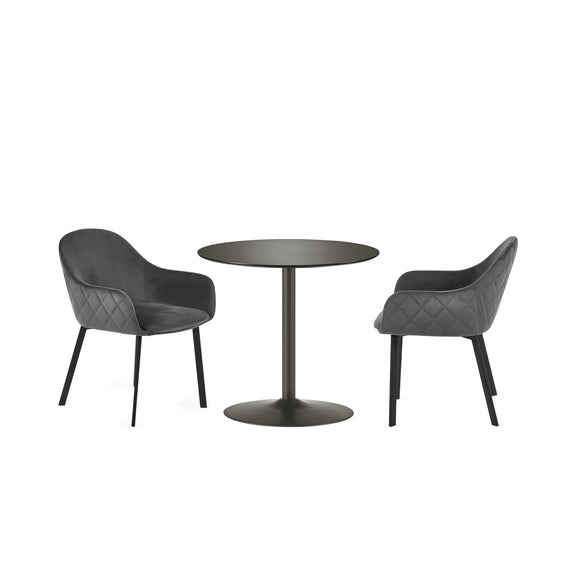 Two dark gray chairs with quilted armrests and a matching round table on a white background