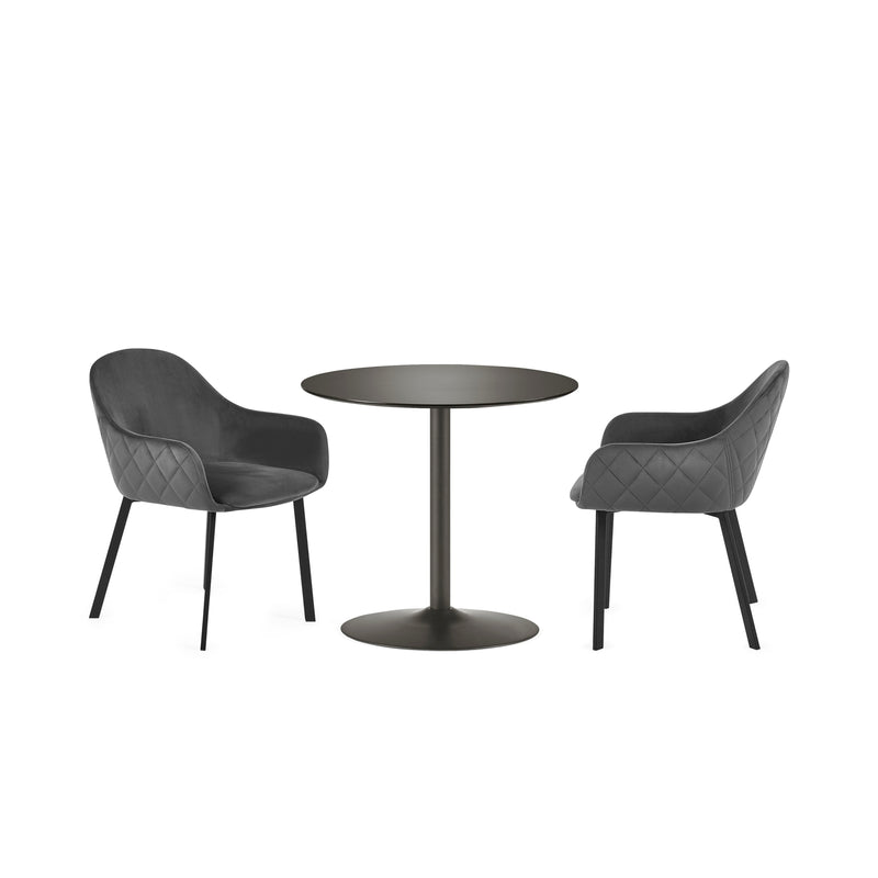 Two dark gray chairs with quilted armrests and a matching round table on a white background