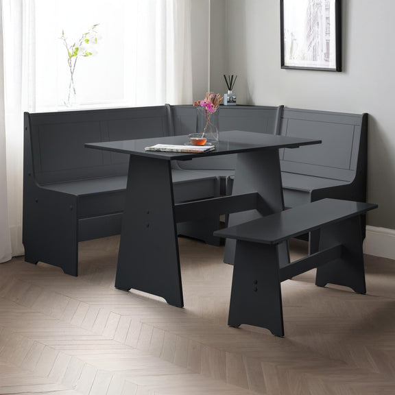 Modern dining room with a black L-shaped bench and table.