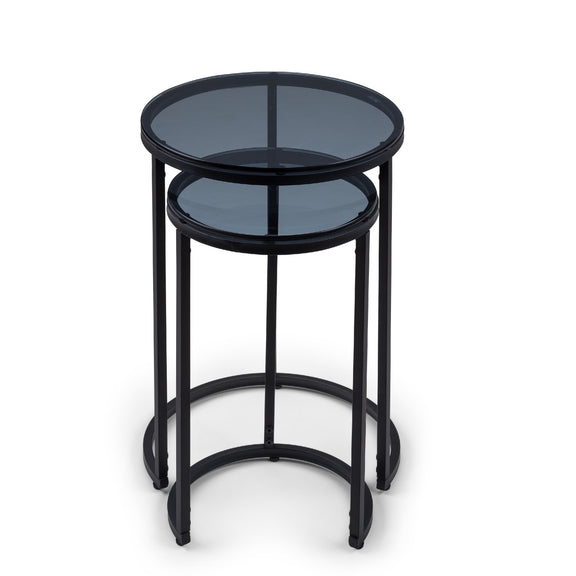Set of two black metal nesting tables on a white background