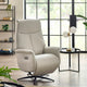 Beige recliner chair in a modern living room with large windows.