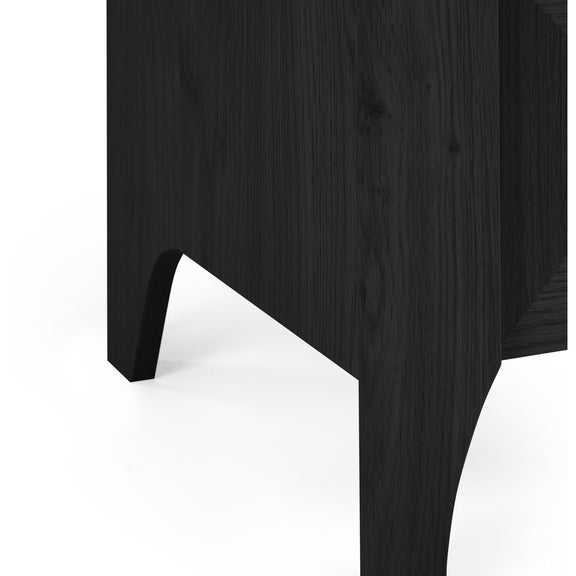 Close-up of a dark wooden bed frame corner on a white background