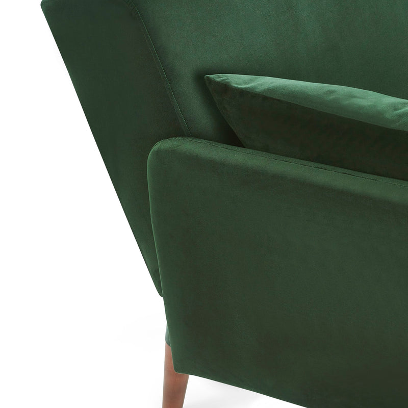 Close-up of a green upholstered chair with a white background