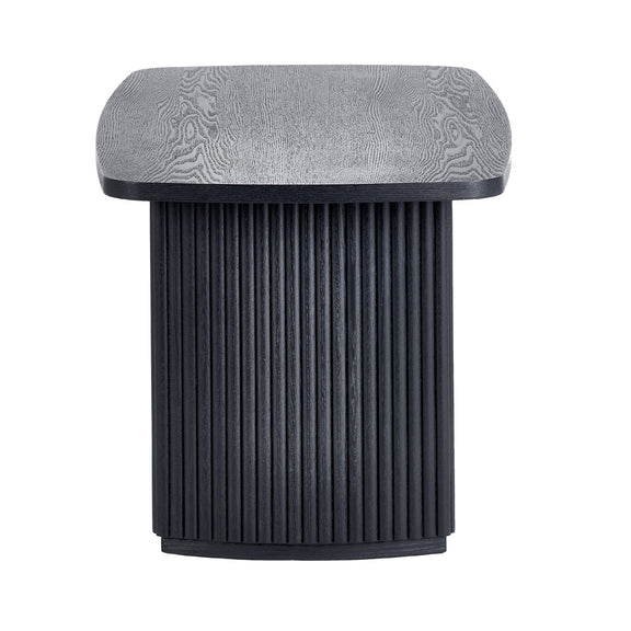 Modern side table with textured gray top and black ribbed cylindrical base on a white background