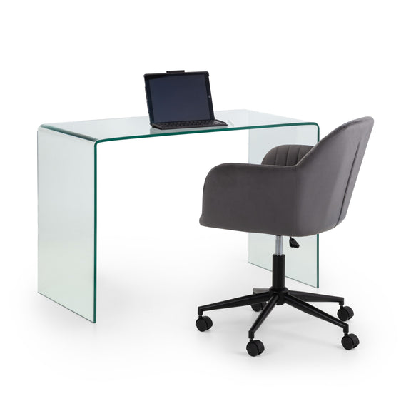 Glass desk with a laptop and a gray office chair on a white background