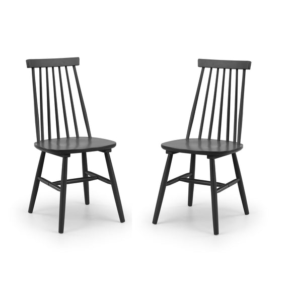Two black wooden chairs on a white background