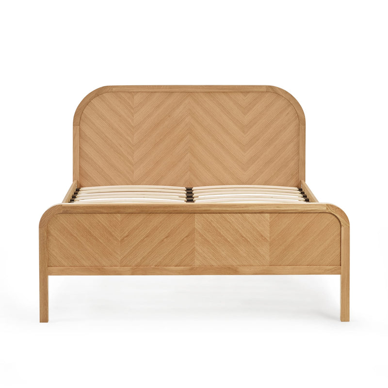 Wooden bed with chevron pattern on a white background