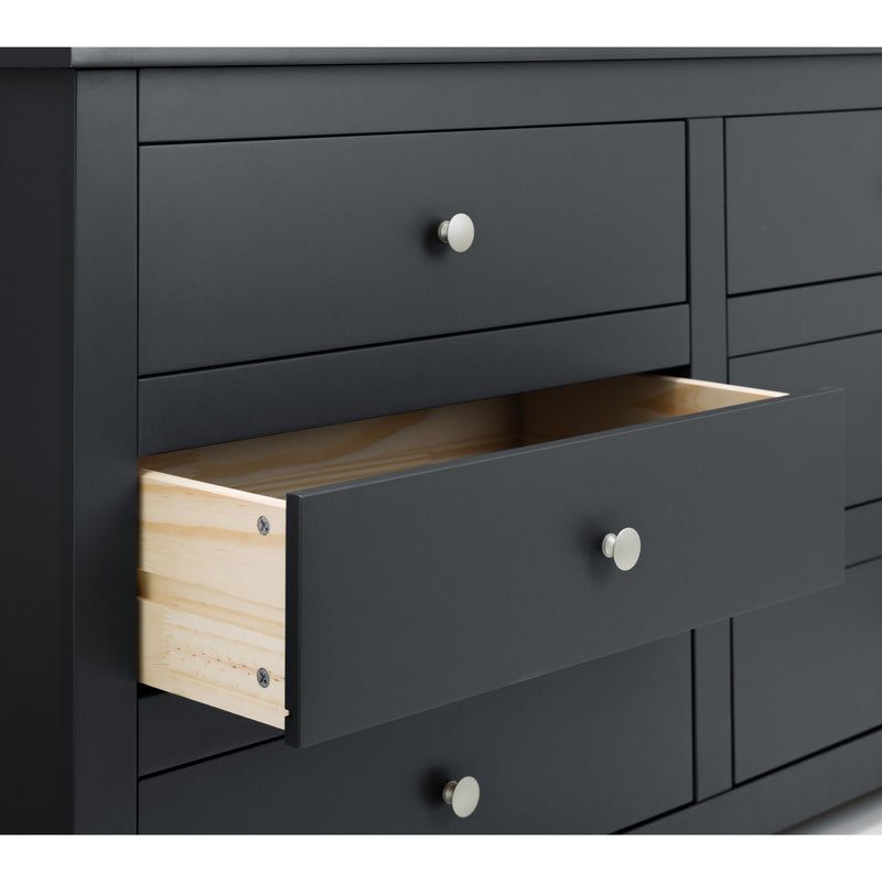 Black dresser with open drawer revealing wooden interior