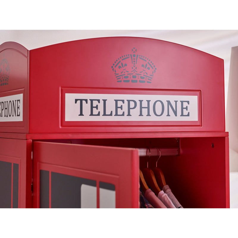 Red telephone box-shaped wardrobe with a coat hanging inside