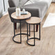 Two wooden side tables with black metal legs in a living room setting.
