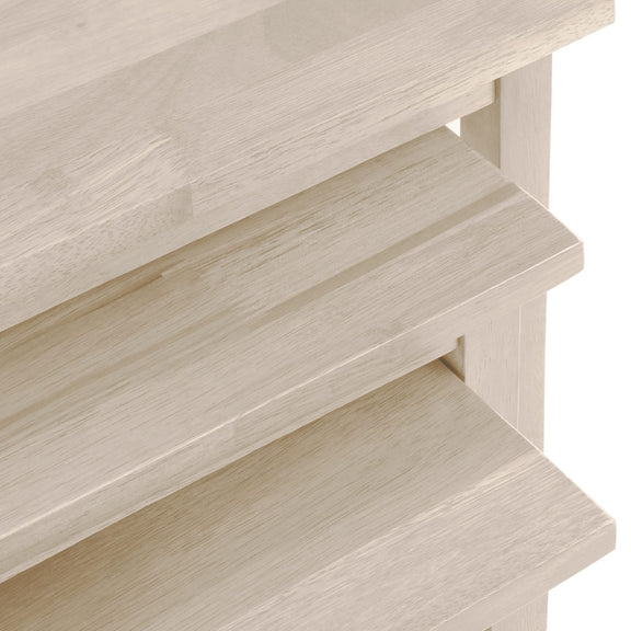 Close-up of a wooden shelf with a light finish on a white background