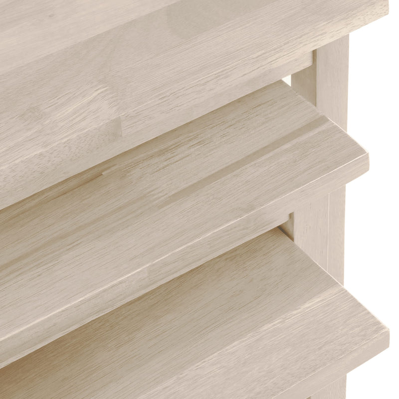 Close-up of a wooden shelf with a light finish on a white background