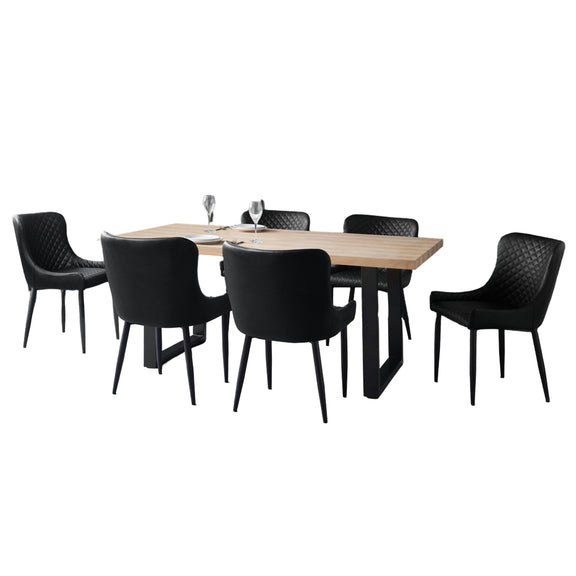 Wooden dining table with six black chairs on a white background