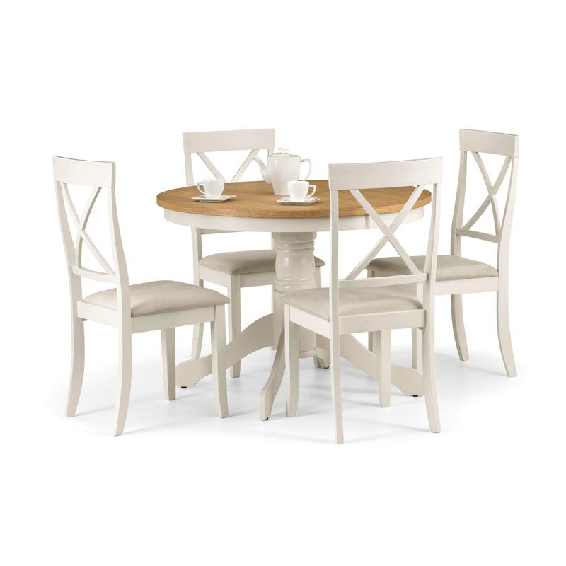 Dining set with a round wooden table and four matching chairs on a white background