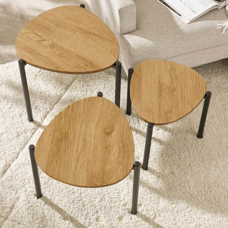Three wooden stools with metal legs on a carpeted floor.