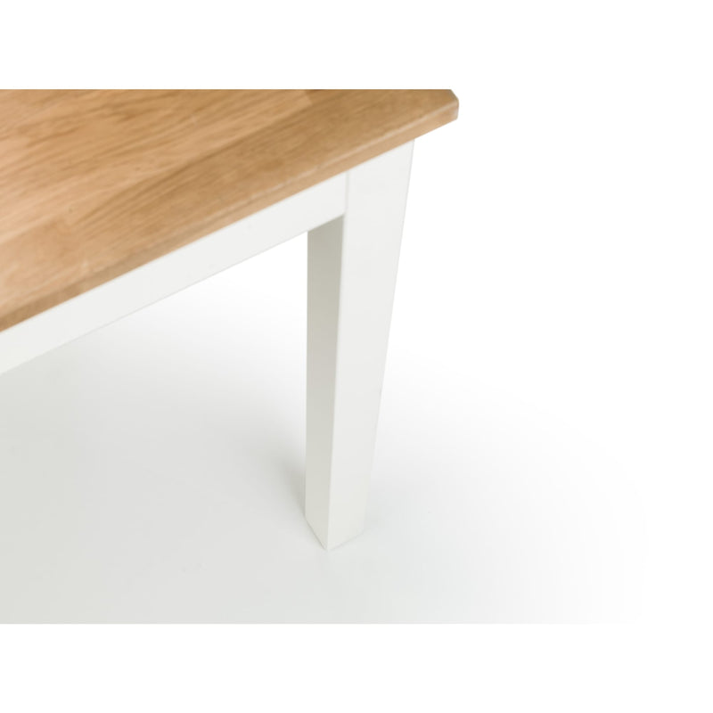 Wooden table top on a white base with a plain background