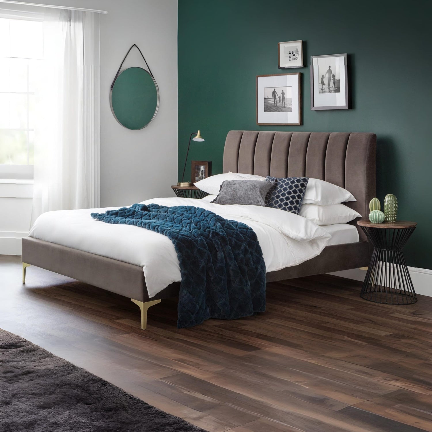 Modern bedroom with a brown upholstered bed, white bedding, and decorative elements.