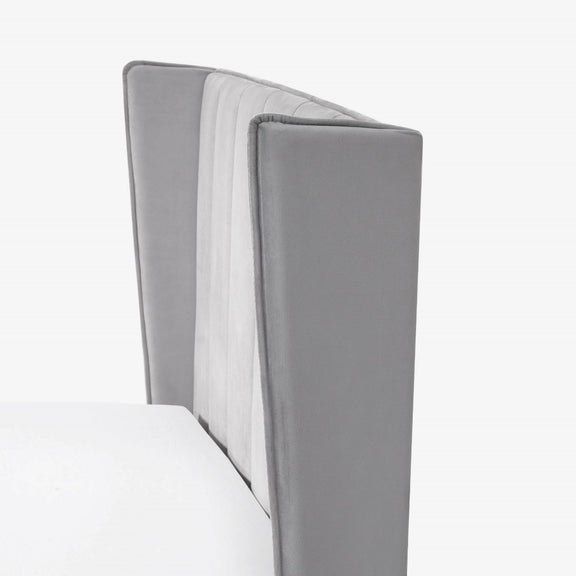 Gray upholstered headboard on a white background