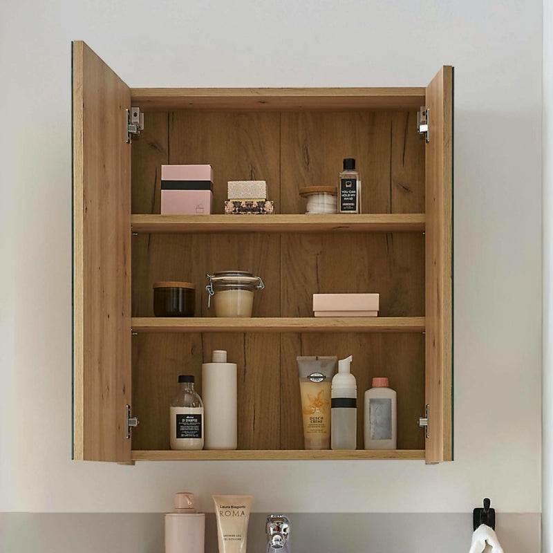 Wooden cabinet with shelves containing various toiletries on a neutral background