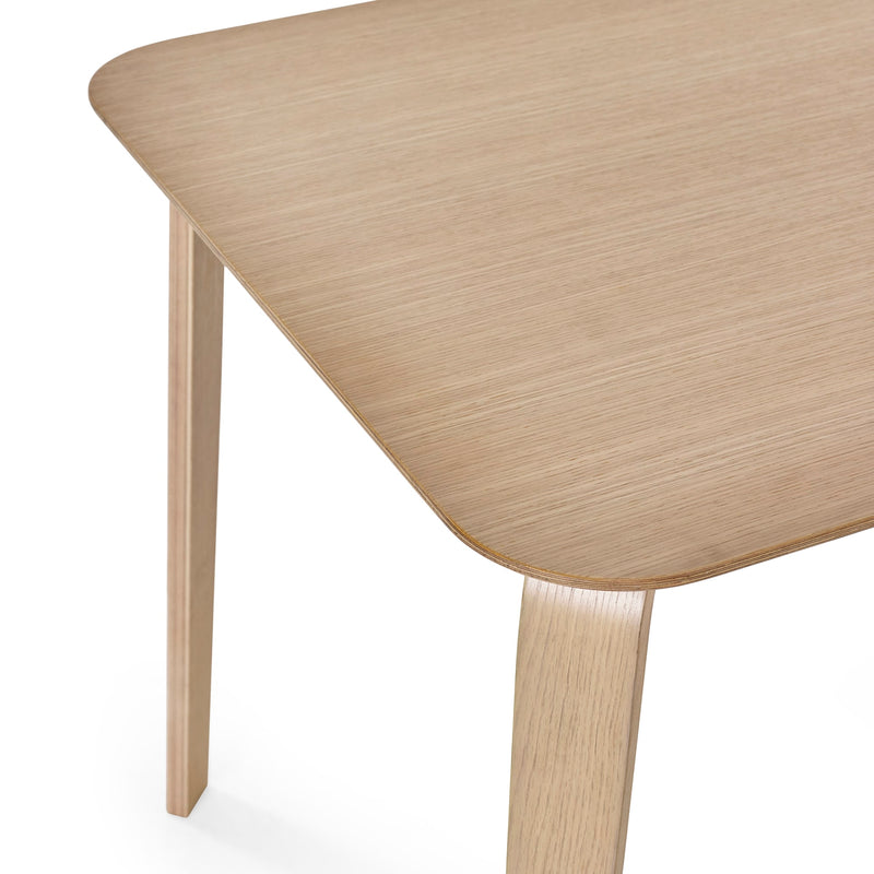 Wooden table with a light finish on a white background