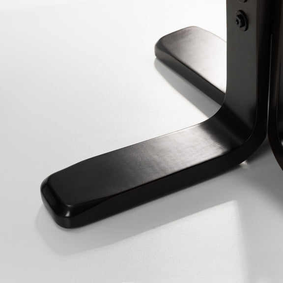 Close-up of a black metal door handle on a white background