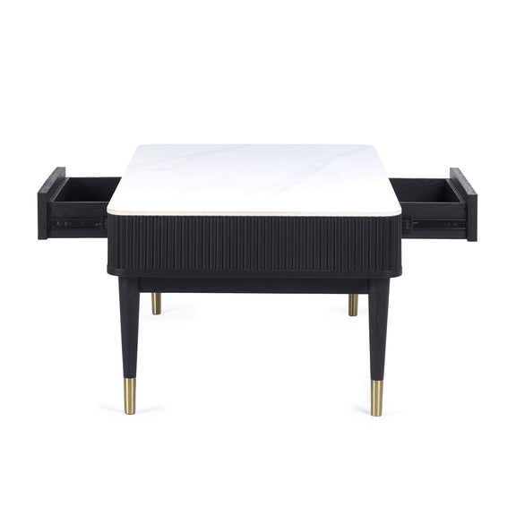 Black side table with white top and gold legs on a white background
