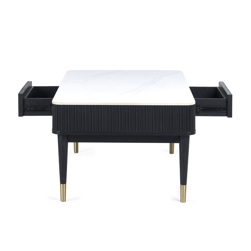 Black side table with white top and gold legs on a white background