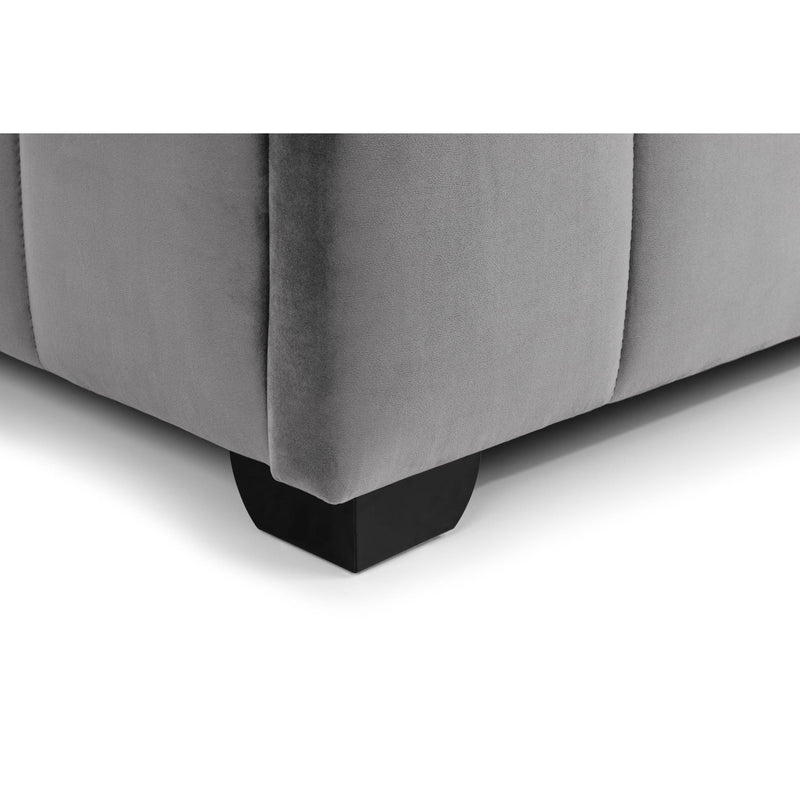 Gray upholstered bed with black wooden legs on a white background