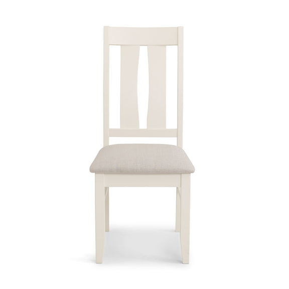 White wooden chair with a beige cushion on a white background