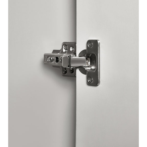 Close-up of a metallic door hinge on a white background