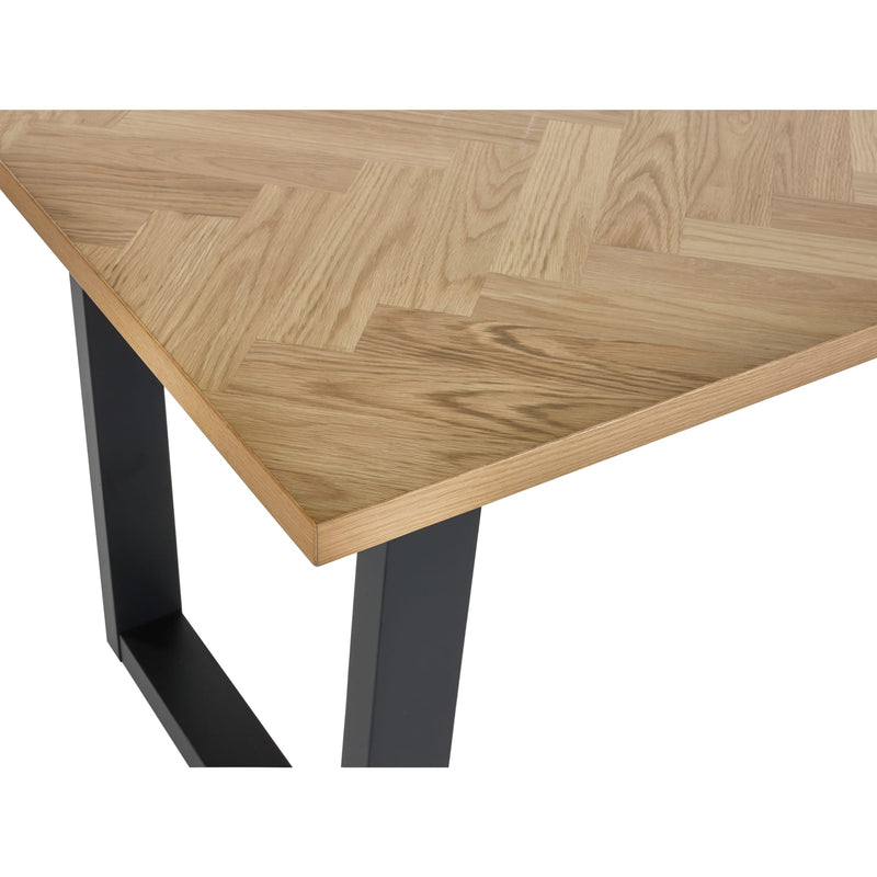 Wooden table with black metal legs on a white background