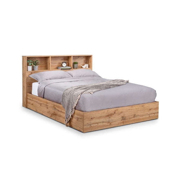 Wooden bed with bookshelf headboard on a white background