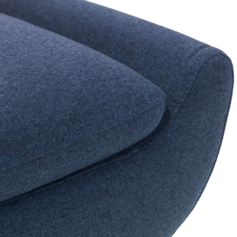 Close-up of a blue upholstered chair with a white background