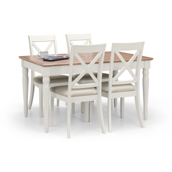 Dining table set with four chairs on a white background