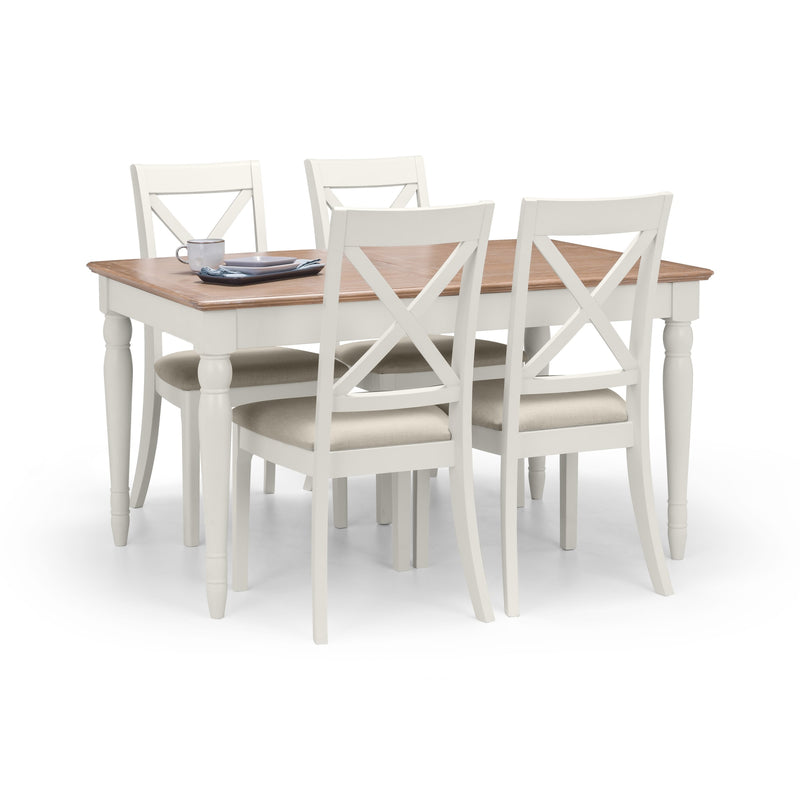 Dining table set with four chairs on a white background