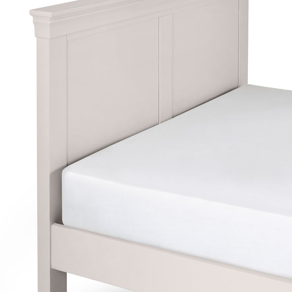 Light gray wooden bed frame with a white mattress on a white background