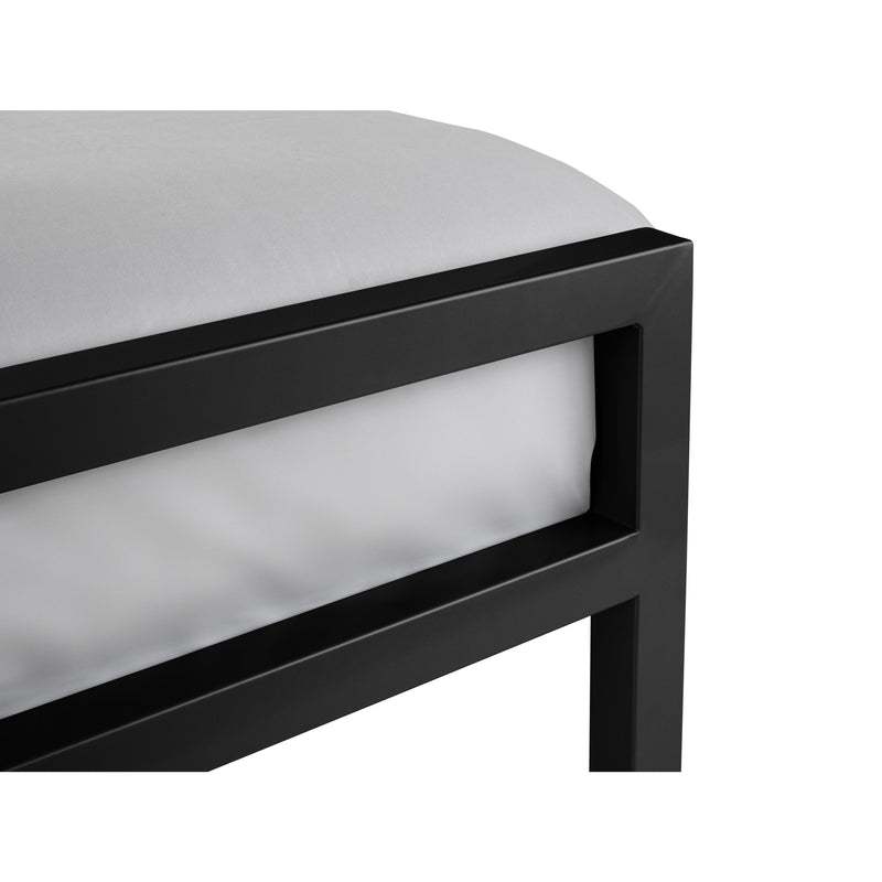 Close-up of a black metal frame with a white cushion on a white background