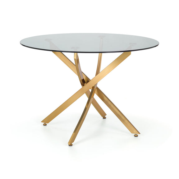 Round glass table with gold metal legs on a white background