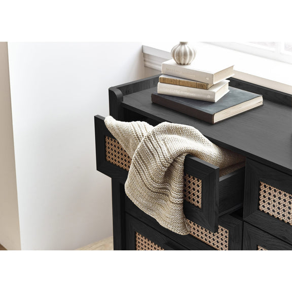 Close-up of black wooden top corner on 6 drawer chest