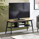 TV on a wooden stand in a living room setting with a plant and sofa.