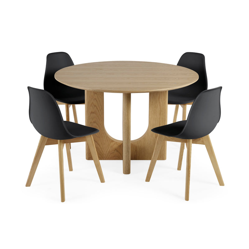 Round wooden table with four black chairs on a white background