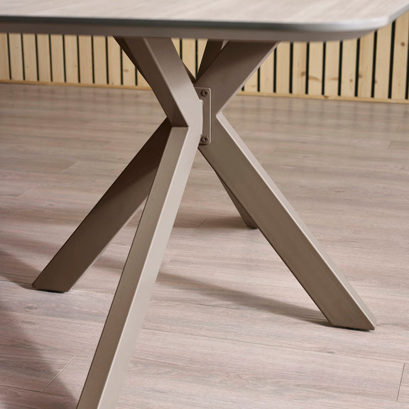 Close-up of a outdoor table with metal legs on a wooden deck