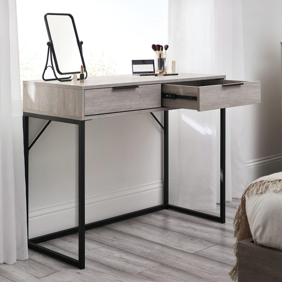 Modern vanity table with mirror and drawers in a bedroom setting