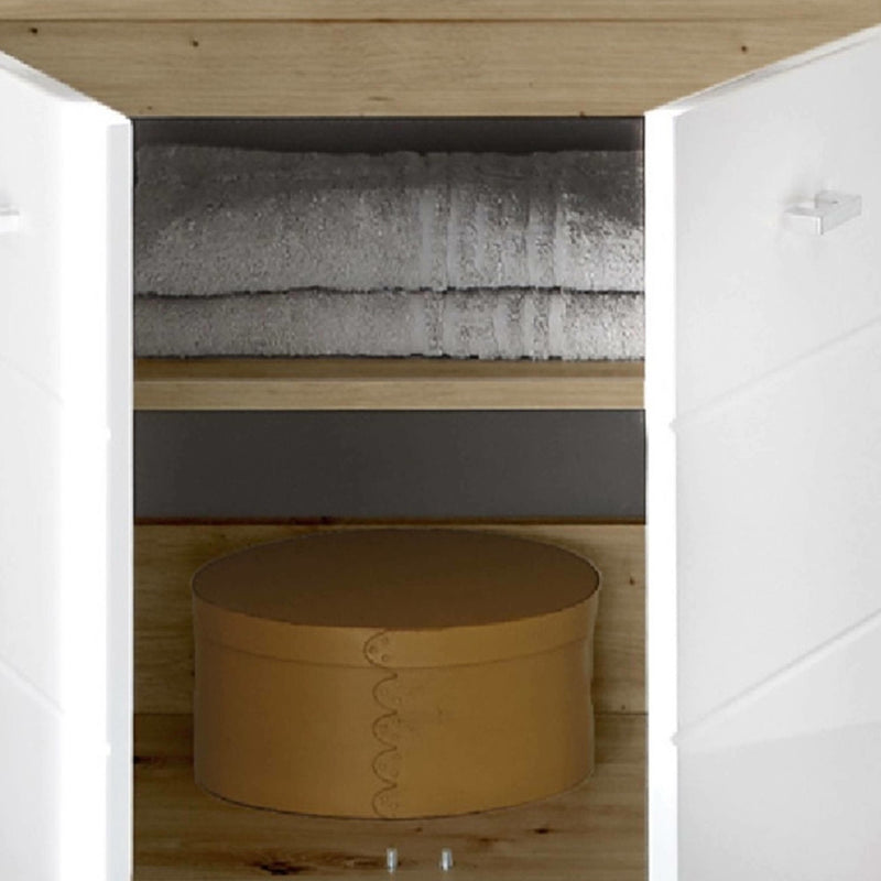 Closet with folded towels and a round brown box on wooden shelves.