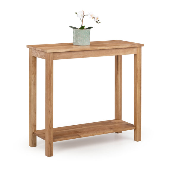 Wooden console table with a plant on a white background