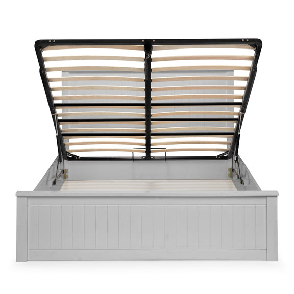 Bed frame with white headboard and black metal slats on a white background