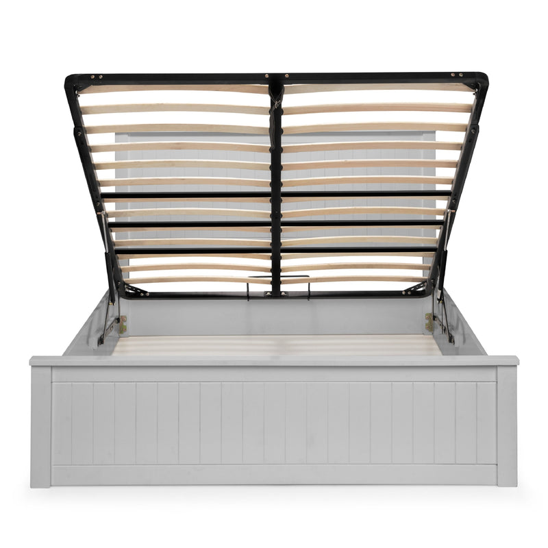 Bed frame with white headboard and black metal slats on a white background
