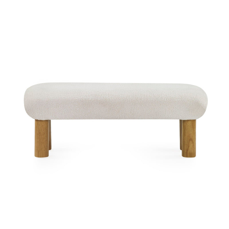 Beige upholstered bench with wooden legs on a white background