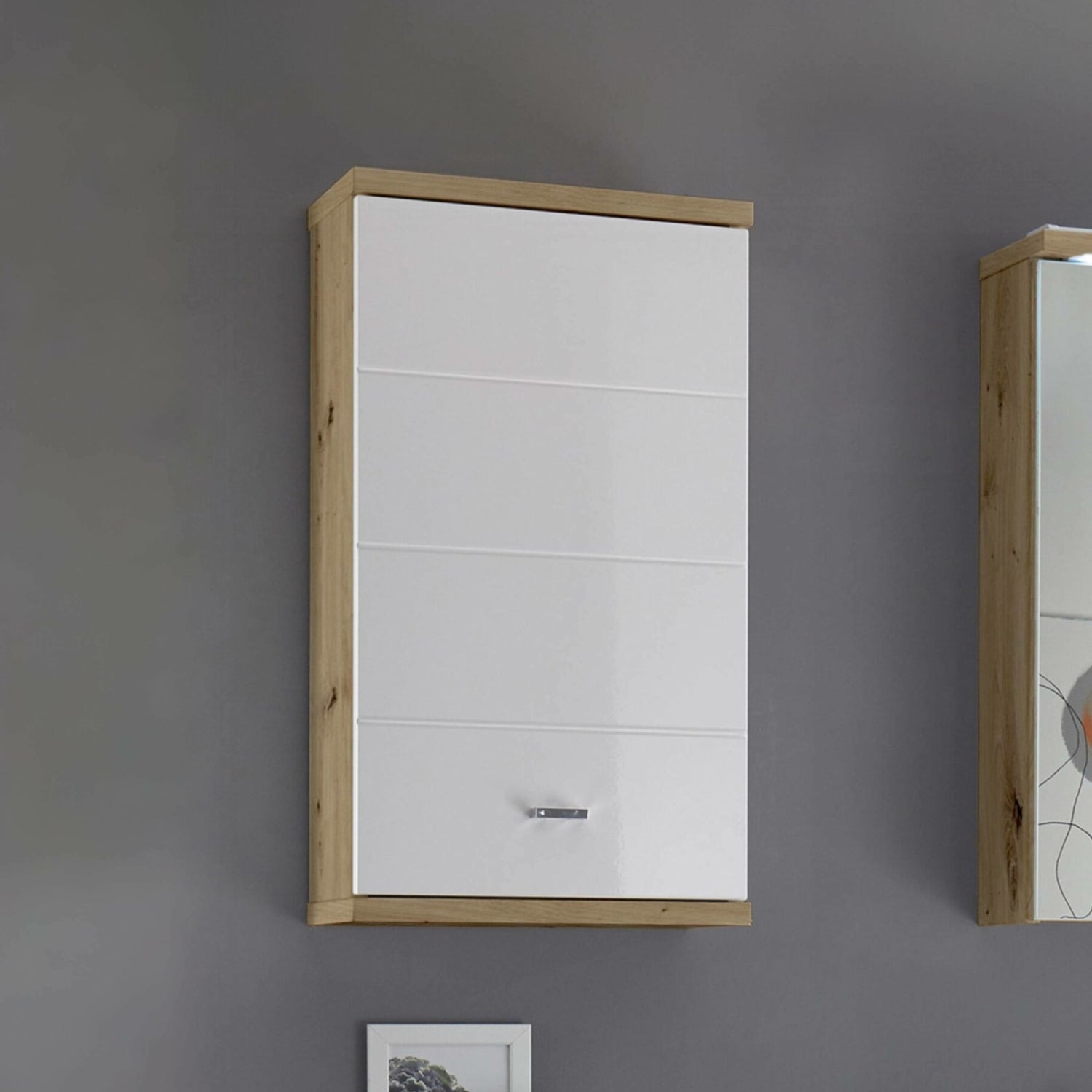 White wardrobe with wooden frame against a gray wall